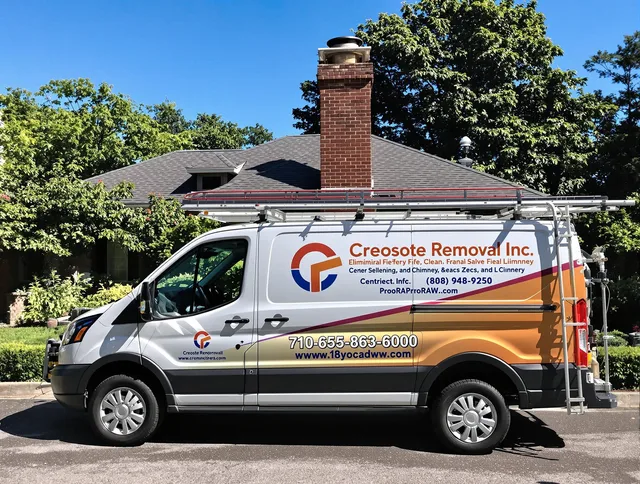 Medway Chimney Sweep technician removing creosote safely in Medway, MA
