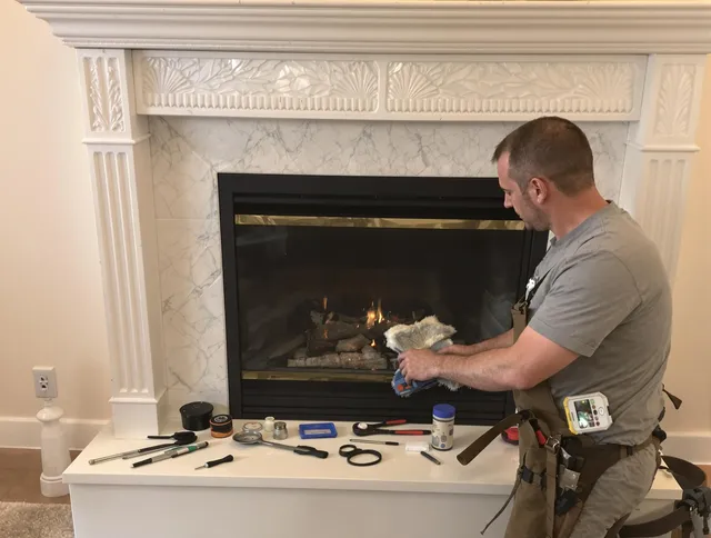 Medway Chimney Sweep performing fireplace maintenance in Medway, MA