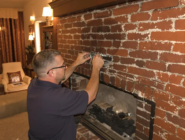 Medway Chimney Sweep expert fixing a fireplace in Medway, MA